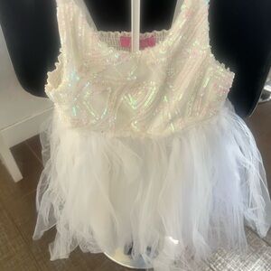 This dress is white, size 5/6. It was bought at a Dennys.